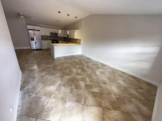 a large kitchen with cabinets