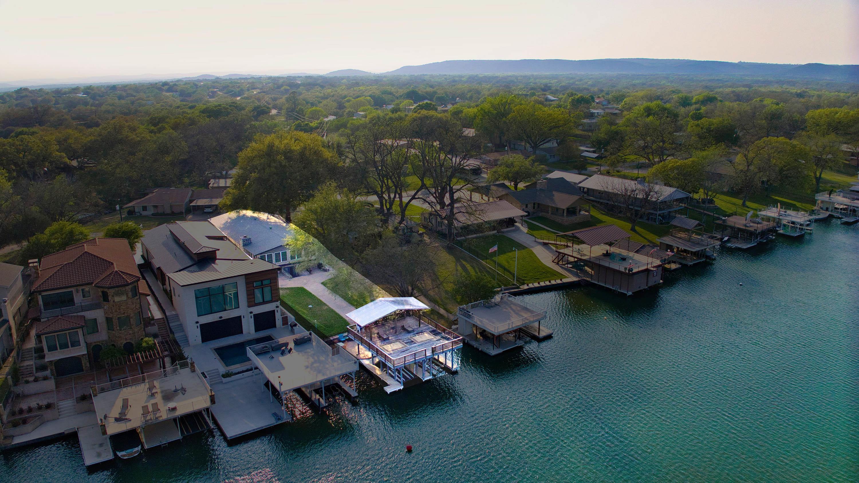 108 Riverside Drive Kingsland, TX 78639 - Photo 1 of 1 an aerial view of a house with a garden and lake view