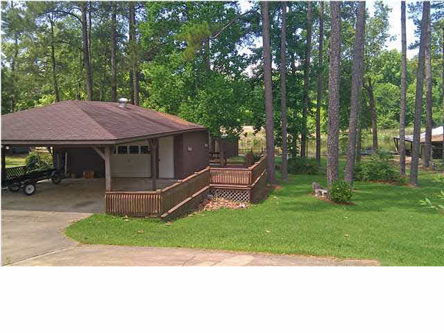 Covered parking, workshop, & deck