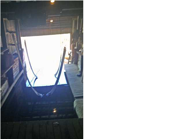 Boat lift inside boathouse