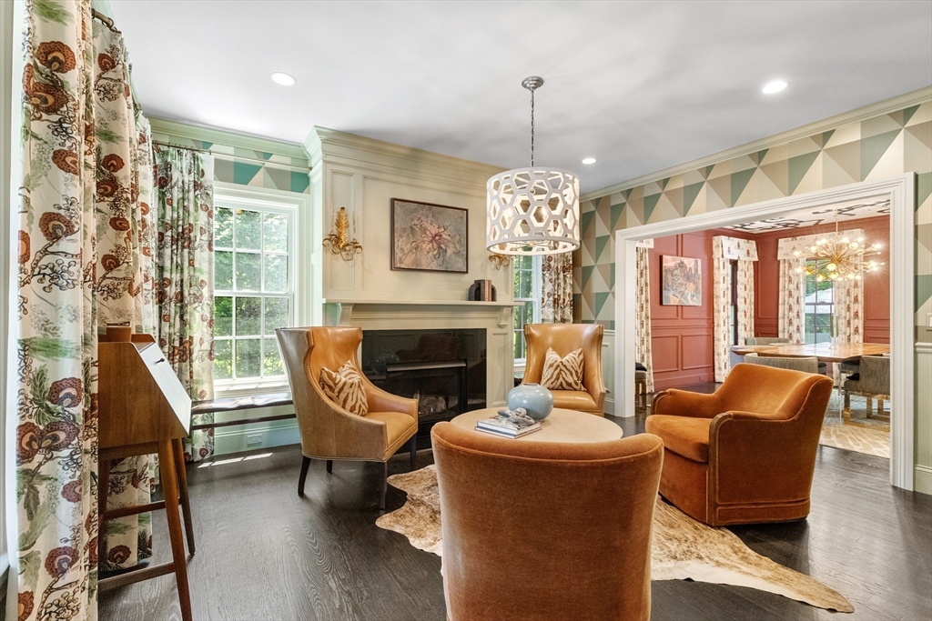 12 Cooke Road Lexington, MA 02420 - Photo 13 of 42 a living room with furniture chandelier and a fireplace