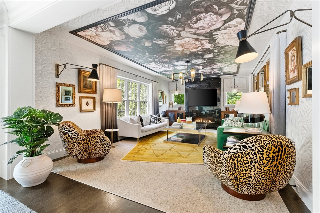 12 Cooke Road Lexington, MA 02420 - Photo 16 of 42 a living room with patio furniture and a flat screen tv