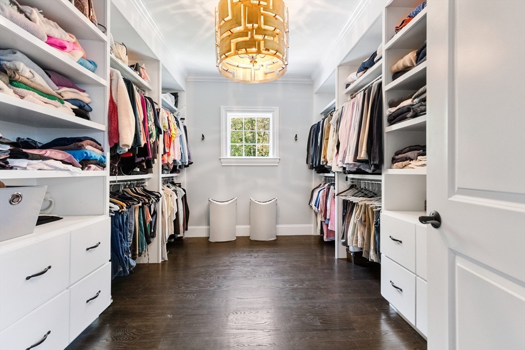 12 Cooke Road Lexington, MA 02420 - Photo 23 of 42 a view of walk in closet with clothes and shoes