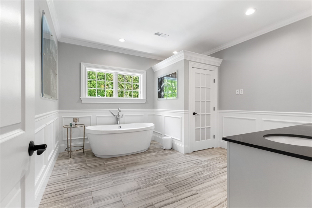 12 Cooke Road Lexington, MA 02420 - Photo 24 of 42 a bathroom with a sink and bathtub