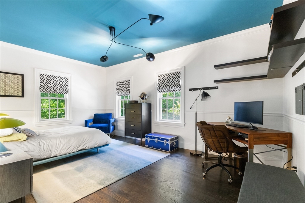 12 Cooke Road Lexington, MA 02420 - Photo 26 of 42 a bedroom with a bed a desk and chair with window