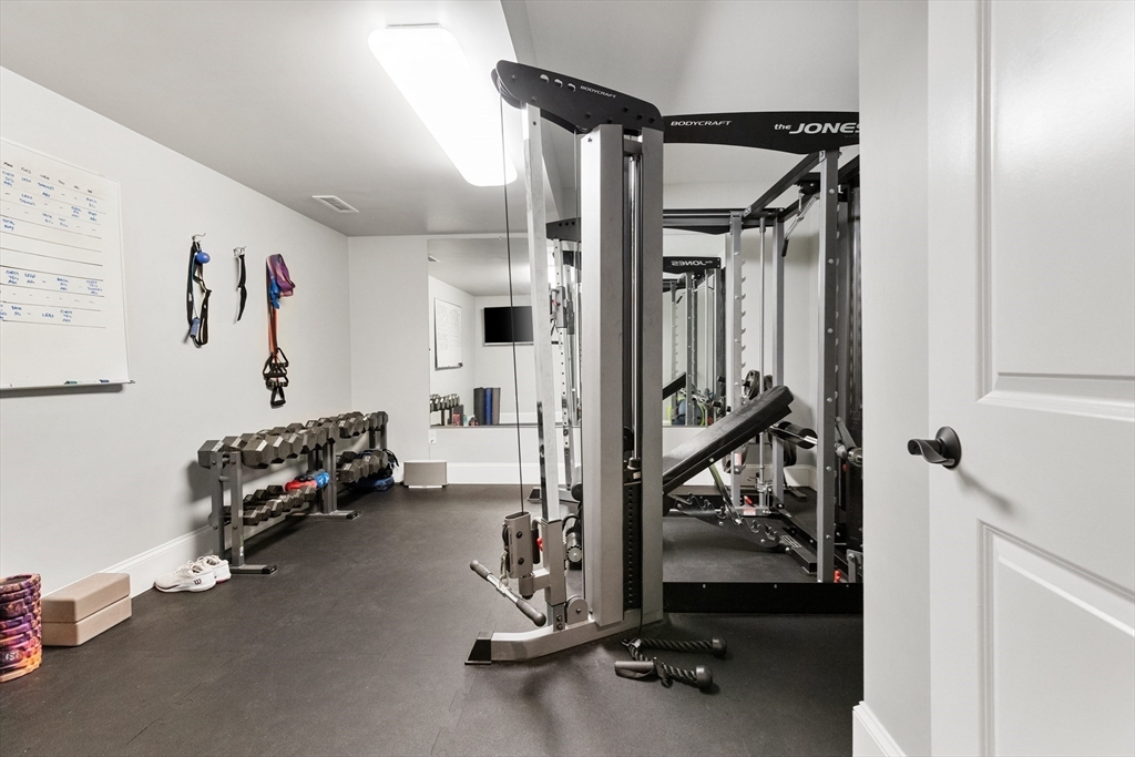 12 Cooke Road Lexington, MA 02420 - Photo 32 of 42 a view of a room with gym equipment