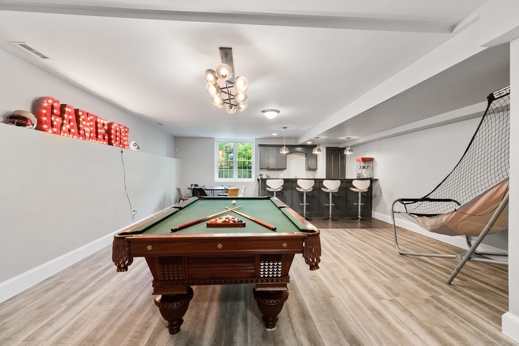 12 Cooke Road Lexington, MA 02420 - Photo 34 of 42 a room with furniture pool table wooden floor and windows