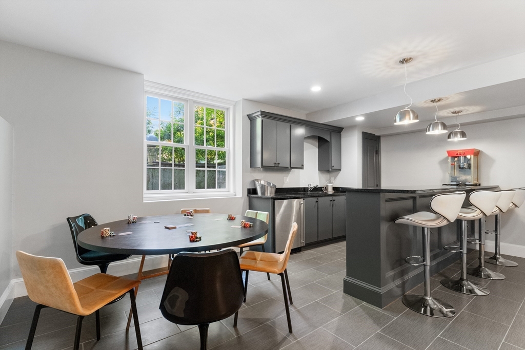 12 Cooke Road Lexington, MA 02420 - Photo 35 of 42 a table and chairs in a room