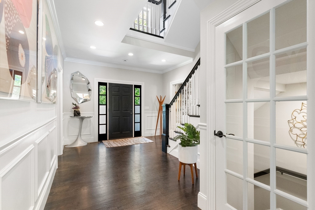 12 Cooke Road Lexington, MA 02420 - Photo 6 of 42 a hallway with wooden floor windows and stairs
