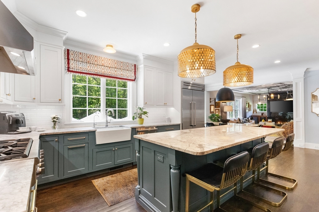 12 Cooke Road Lexington, MA 02420 - Photo 9 of 42 a kitchen with a stove a sink and a dining table