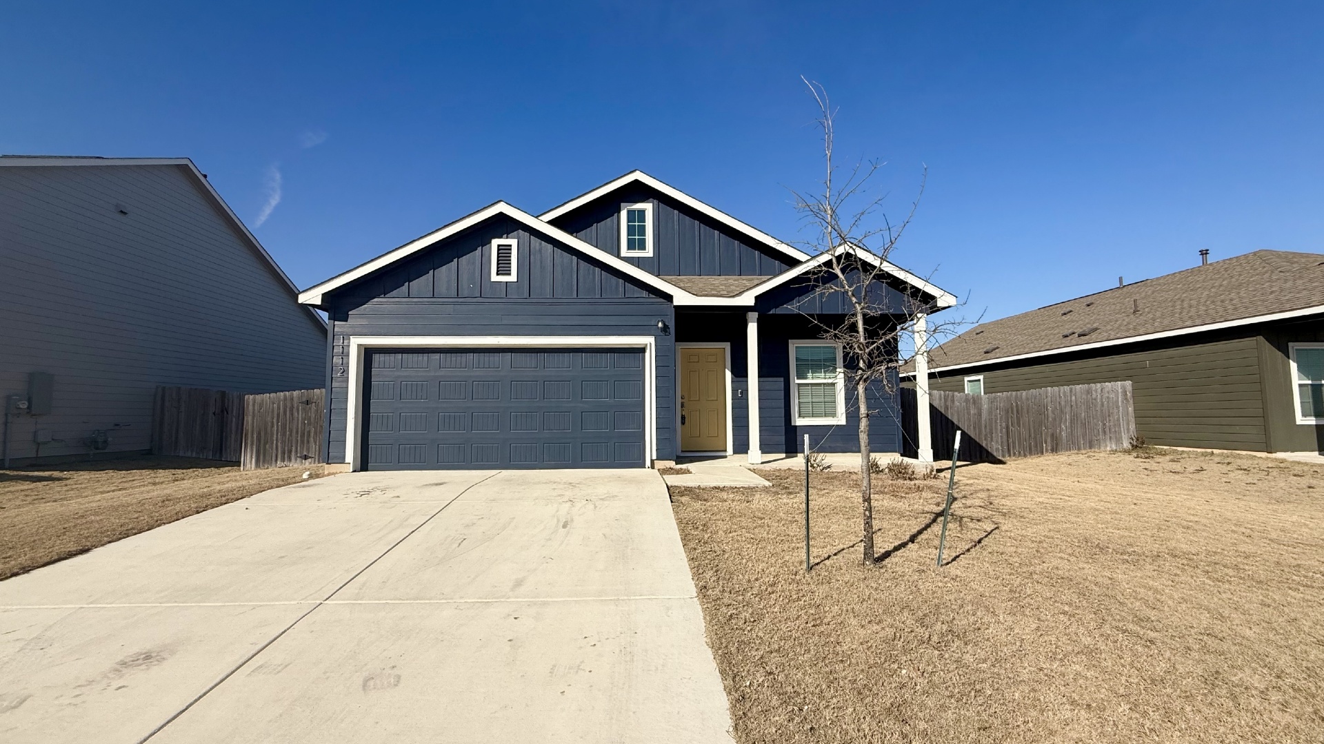 1112 Rio Frio Lane Georgetown, TX 78626 - Photo 1 of 21 View of front of property featuring concrete driveway, board and batten siding, and a garage