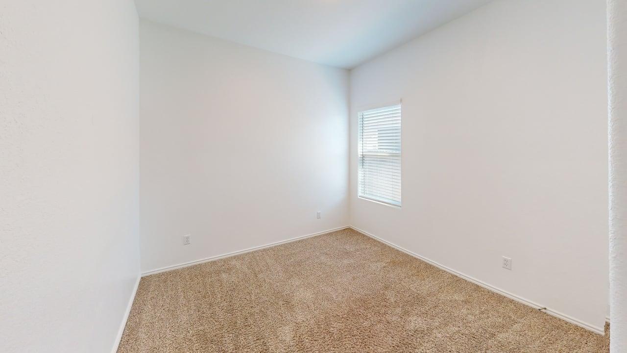 1112 Rio Frio Lane Georgetown, TX 78626 - Photo 13 of 21 Spare room featuring carpet flooring and baseboards