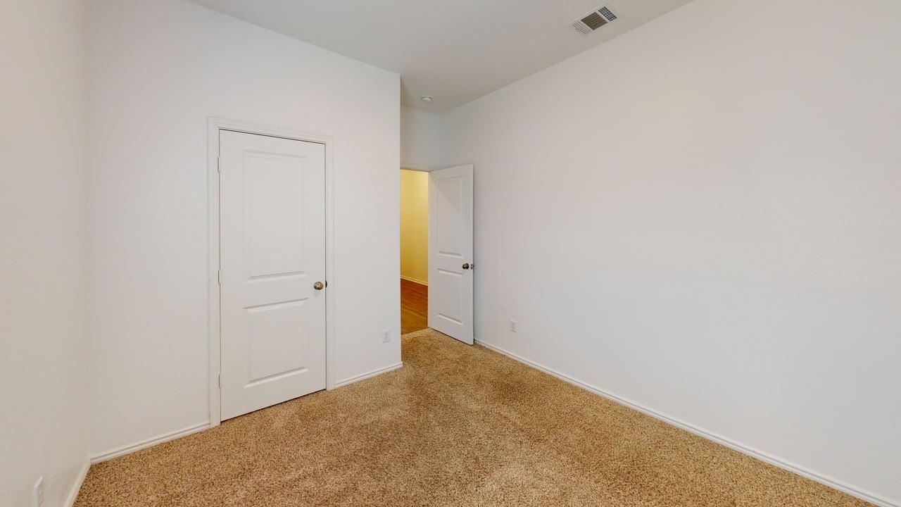 1112 Rio Frio Lane Georgetown, TX 78626 - Photo 15 of 21 Unfurnished bedroom featuring carpet flooring and baseboards