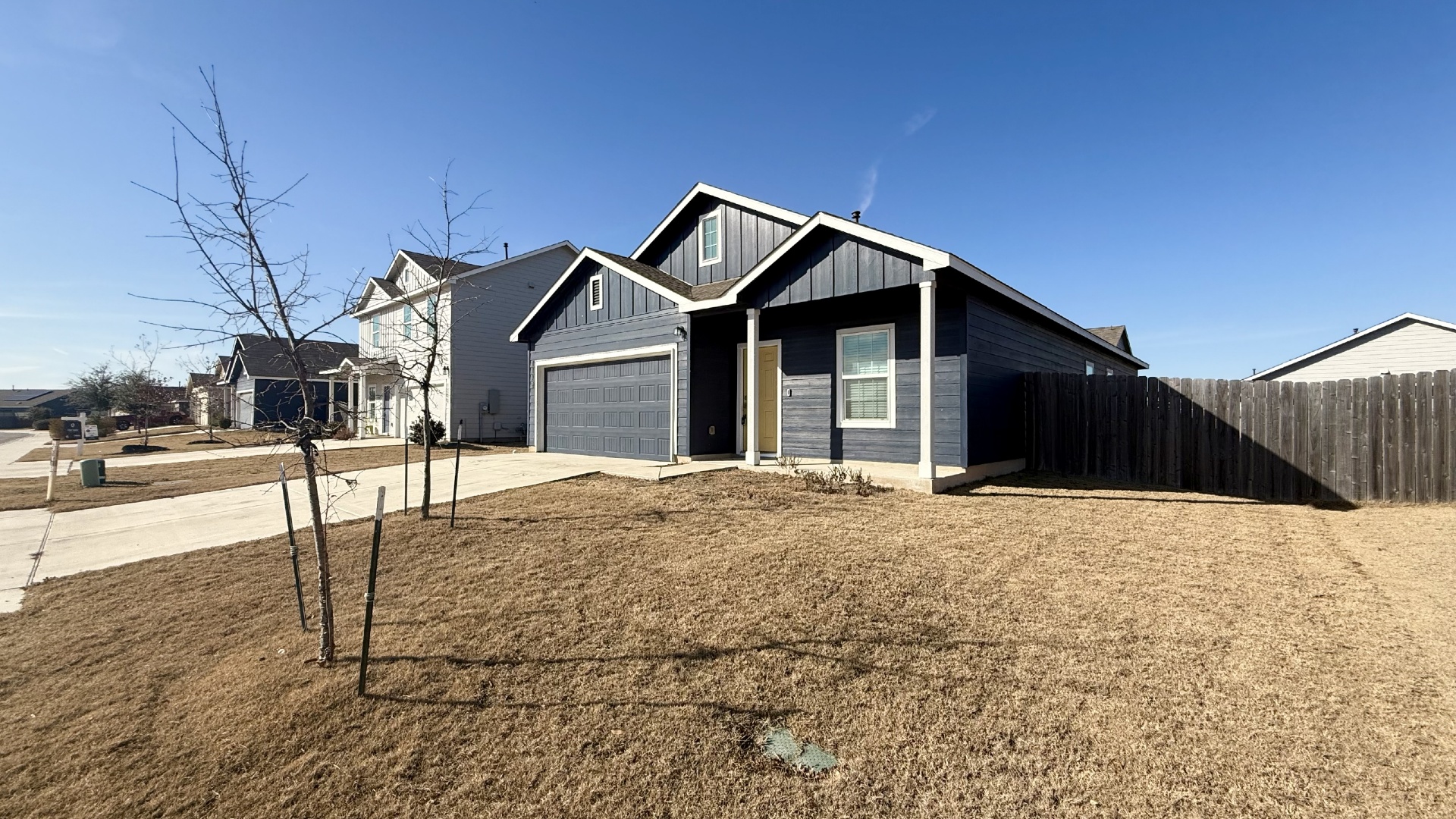 1112 Rio Frio Lane Georgetown, TX 78626 - Photo 3 of 21 View of front facade featuring driveway, board and batten siding, and a garage