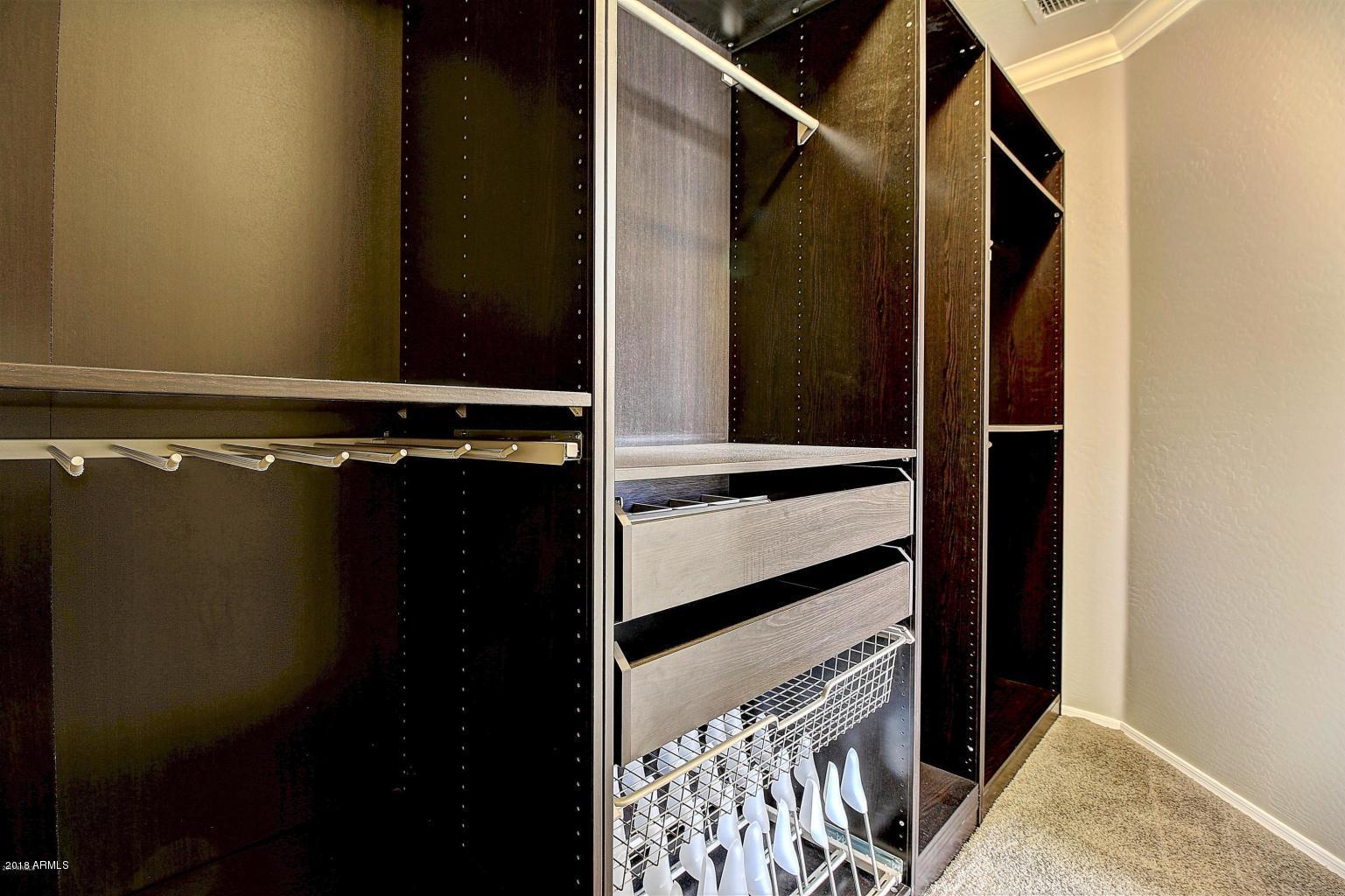 15923 West Redfield Road Surprise, AZ 85379 - Photo 13 of 23 Master walk in closet with built ins