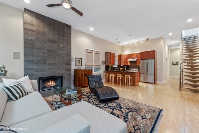 2029 West Rice Street, Unit 3 Chicago, IL 60622 - Photo 4 of 11 a living room with furniture and a fireplace