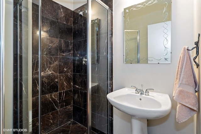 2029 West Rice Street, Unit 3 Chicago, IL 60622 - Photo 8 of 11 a bathroom with a sink toilet and shower