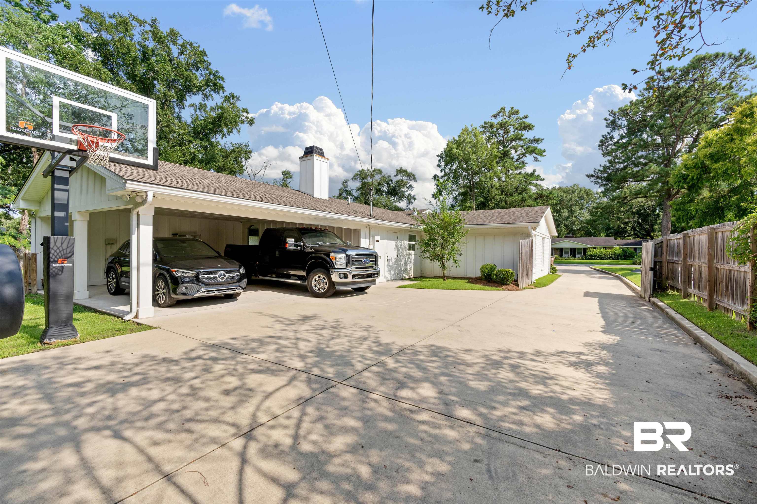3808 Claridge Road North Mobile, AL 36608 - Photo 43 of 43 View of parking featuring a carport