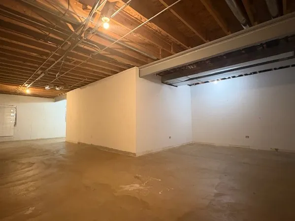 a front view of a house with a garden and yard