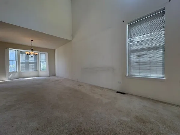 an empty room with windows