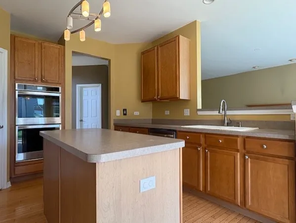a kitchen with a sink and cabinets