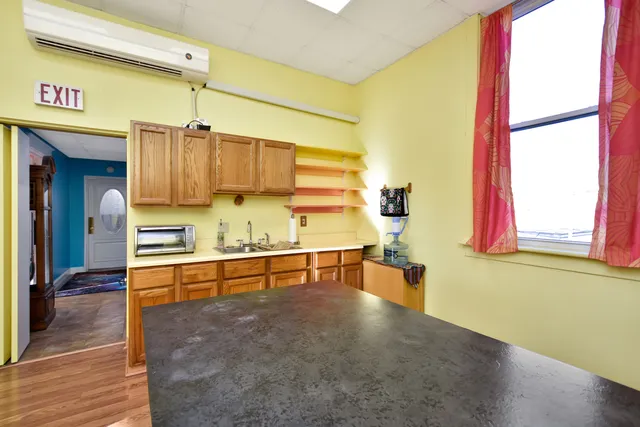 a view of kitchen and dining room with furniture