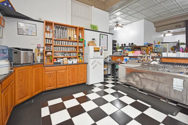 a room with stainless steel appliances and cabinets