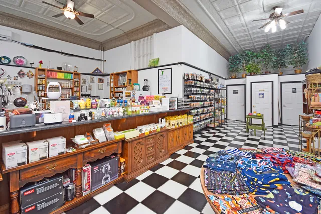 a bathroom with a sink mirror and toilet