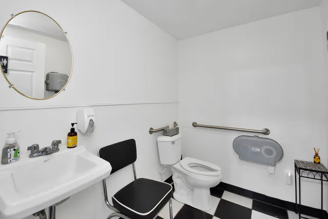 a bedroom with furniture and a window