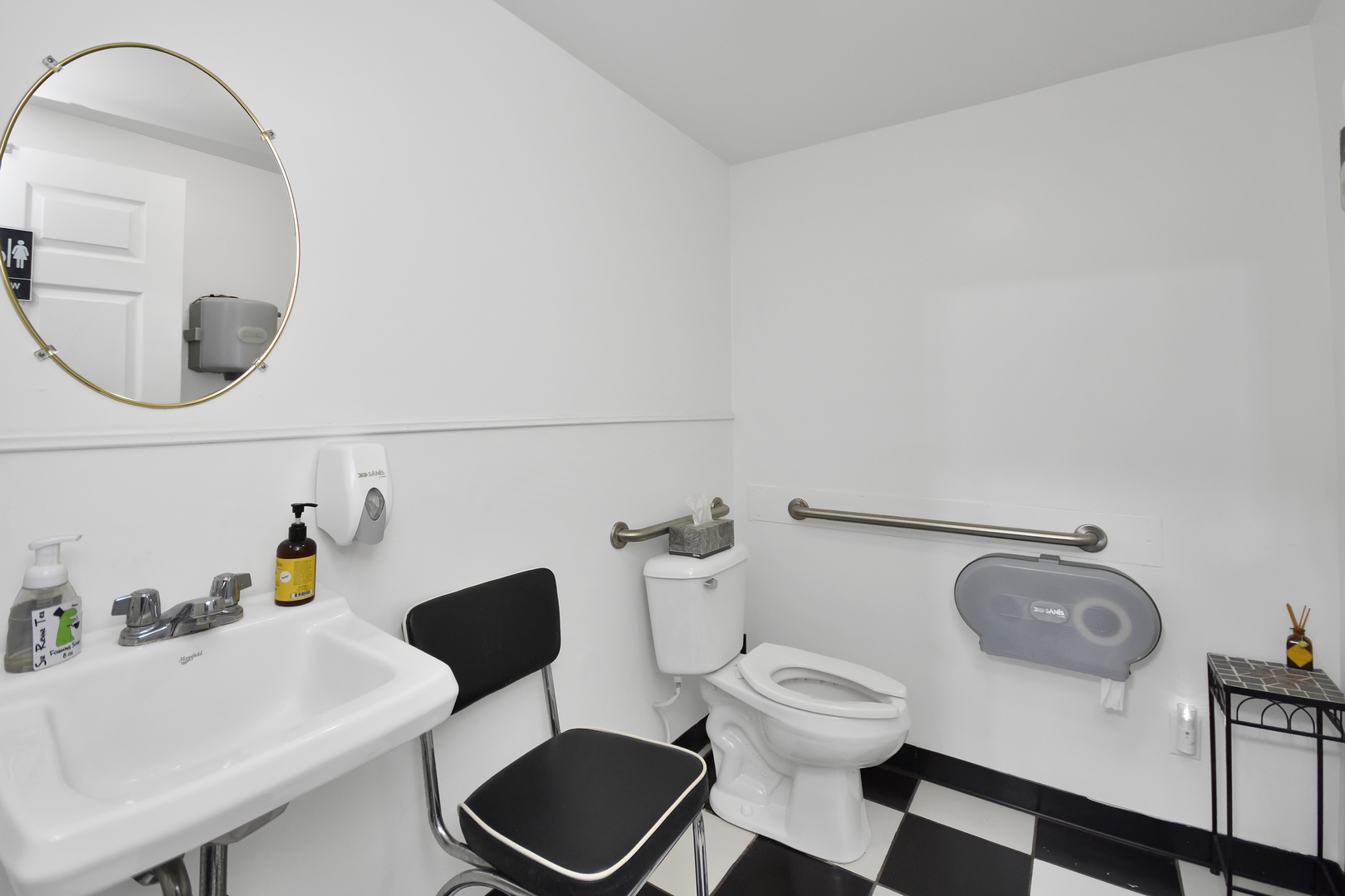 113 North Kickapoo Street Lincoln, IL 62656 - Photo 29 of 48 a bathroom with a sink mirror and toilet