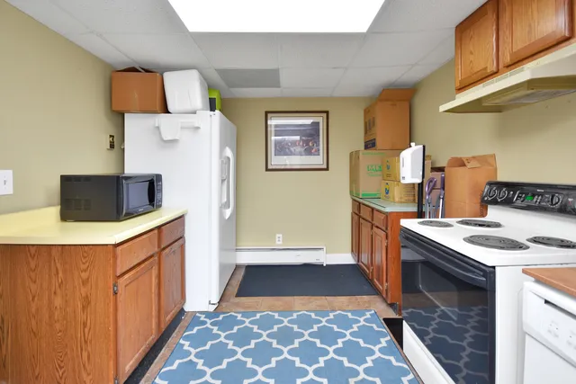 a bathroom with a shower and toilet