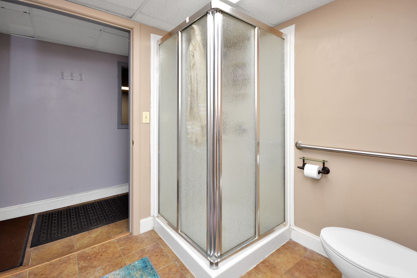 113 North Kickapoo Street Lincoln, IL 62656 - Photo 38 of 48 a bathroom with a shower and toilet