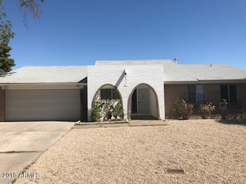a front view of a house with snow
