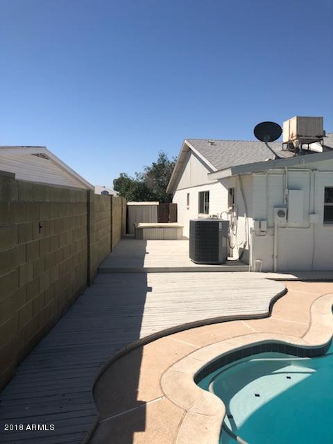 4008 West Davidson Lane Phoenix, AZ 85051 - Photo 11 of 12 a front view of a house with trees