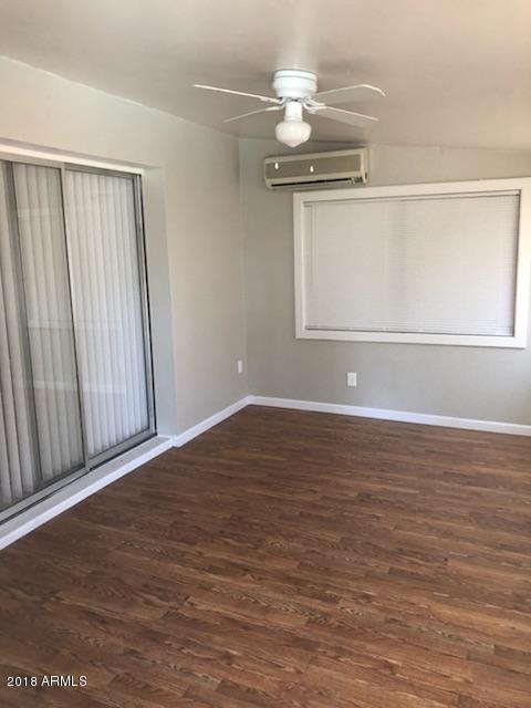 4008 West Davidson Lane Phoenix, AZ 85051 - Photo 12 of 12 a view of a room with wooden floor
