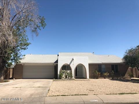4008 West Davidson Lane Phoenix, AZ 85051 - Photo 2 of 12 a view of garage with a tree