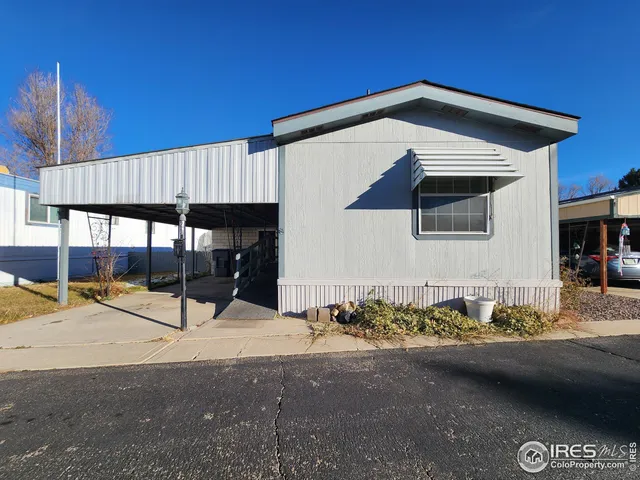 a view of a house with a car park