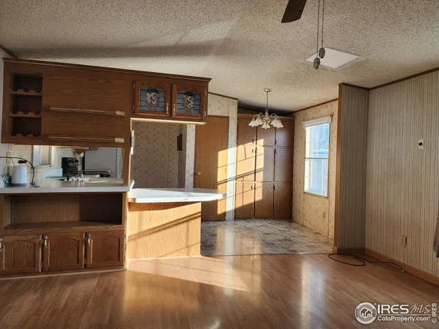 a kitchen with a sink cabinets and window