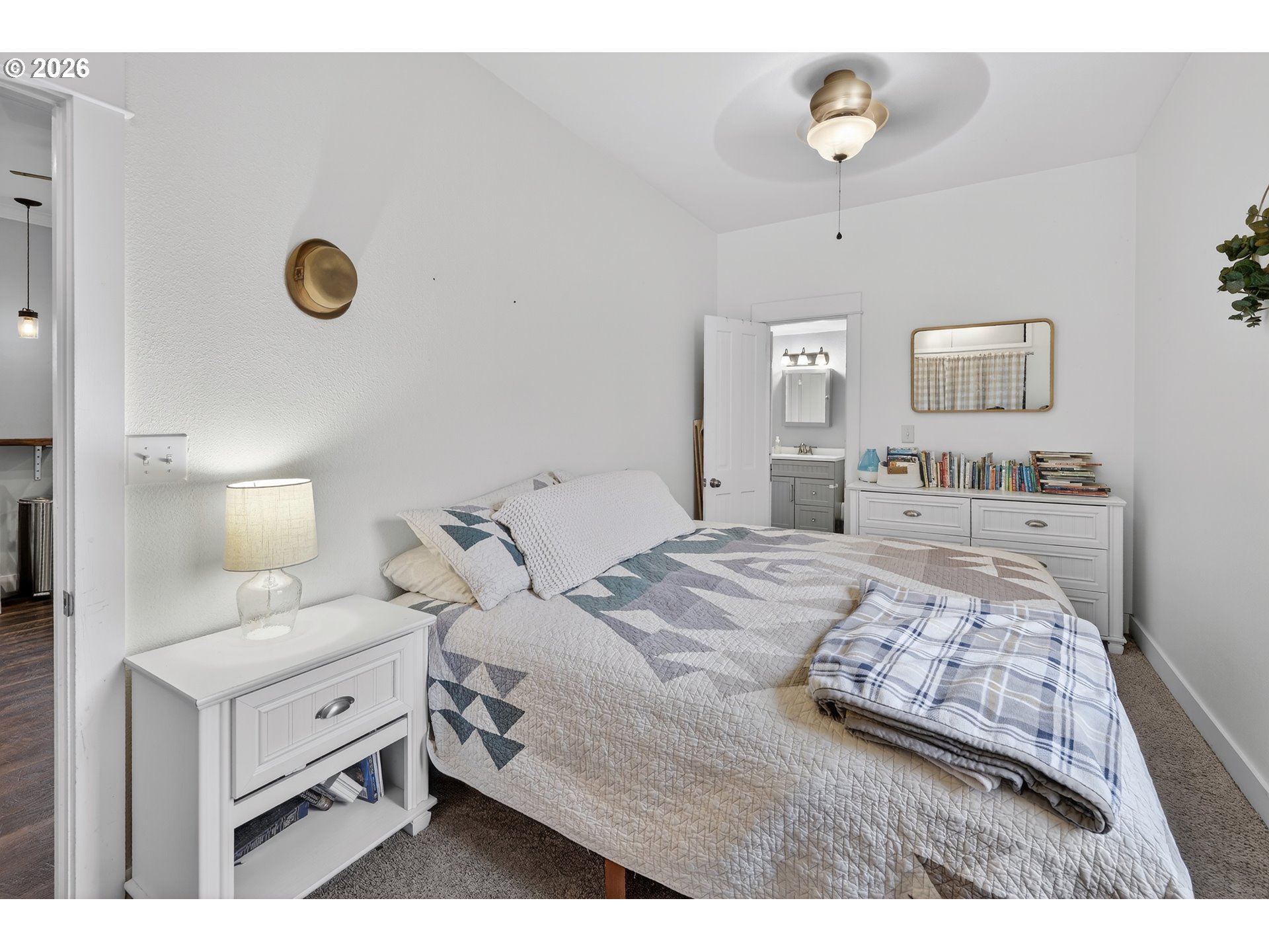 352 21st Street Northeast Salem, OR 97301 - Photo 16 of 41 a bedroom with a bed and a lamp