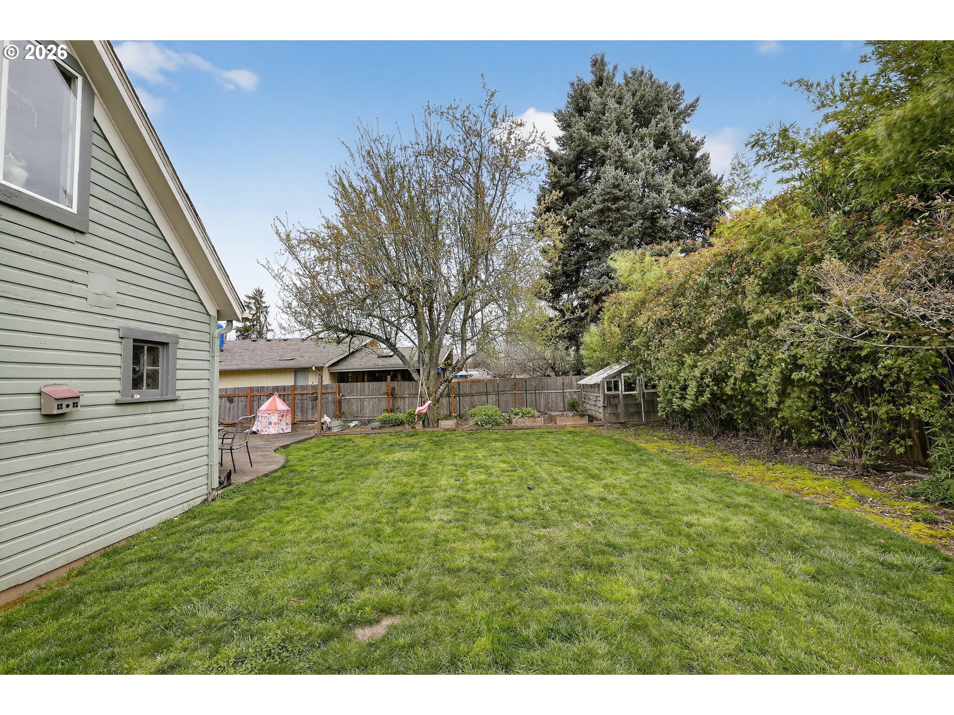 352 21st Street Northeast Salem, OR 97301 - Photo 31 of 41 a view of a backyard with plants and large trees