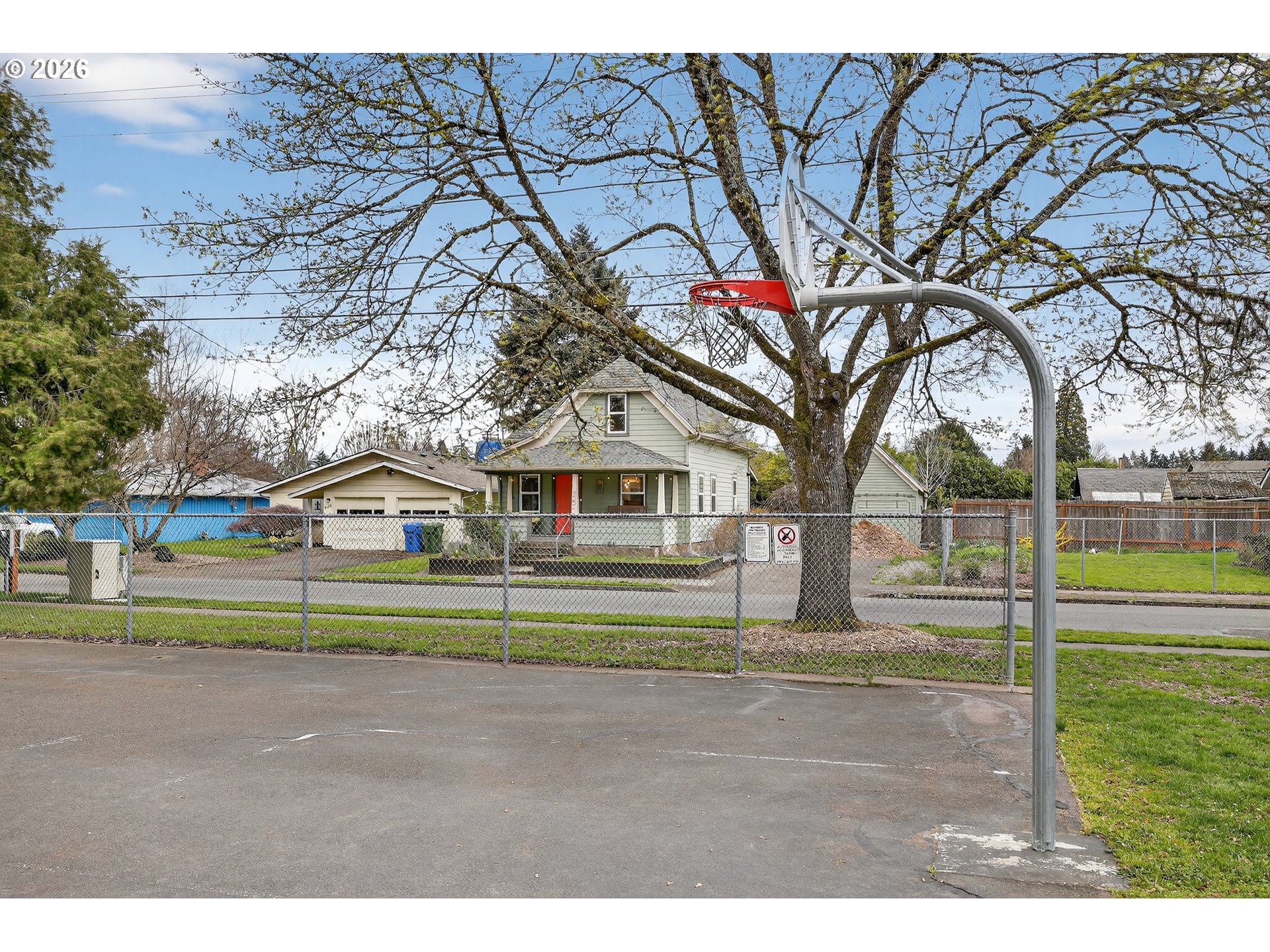 352 21st Street Northeast Salem, OR 97301 - Photo 37 of 41 a small white house with a big yard and large trees