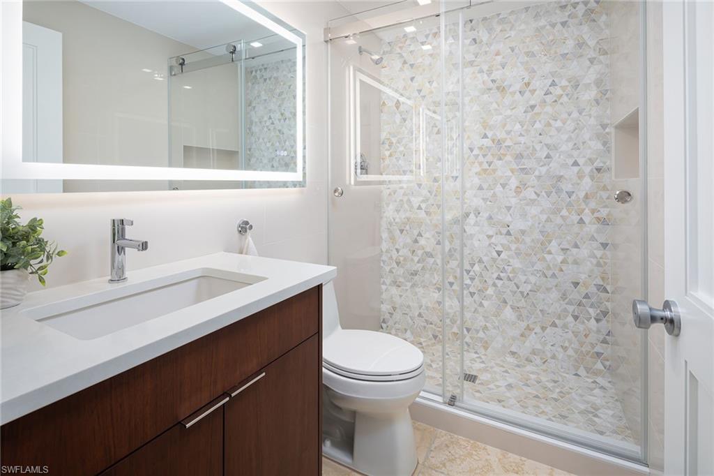 1070 5th Street South Naples, FL 34102 - Photo 15 of 23 a bathroom with a sink toilet and shower