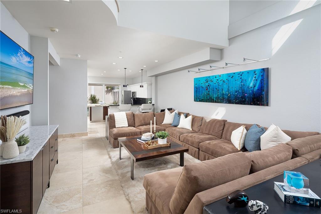 1070 5th Street South Naples, FL 34102 - Photo 2 of 23 a living room with furniture and a couch