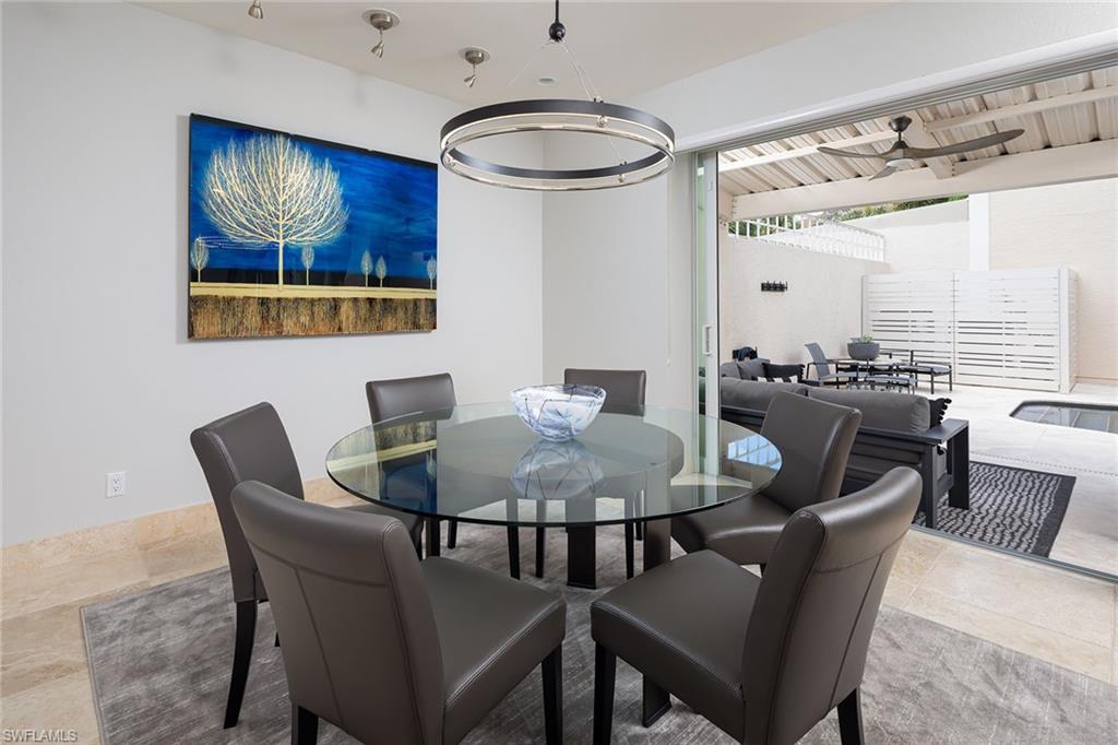 1070 5th Street South Naples, FL 34102 - Photo 8 of 23 a dining room with furniture and window