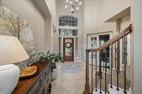 a dining room with furniture entryway and wooden floor