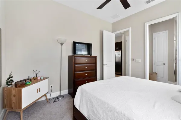 a bedroom with a bed and a tv