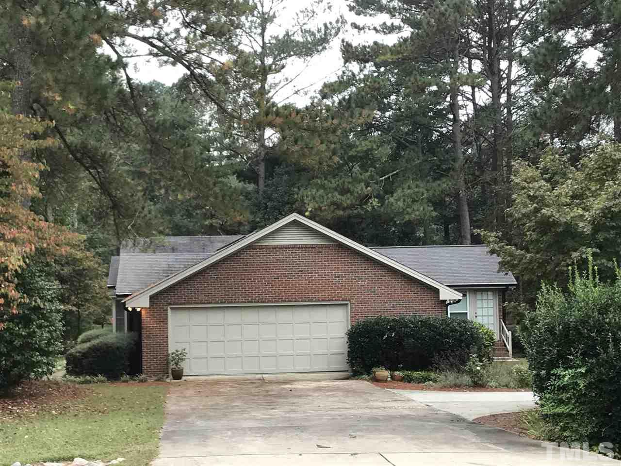 2907 Dunhaven Drive Garner, NC 27529 - Photo 4 of 25 a front view of a house with a yard and garage