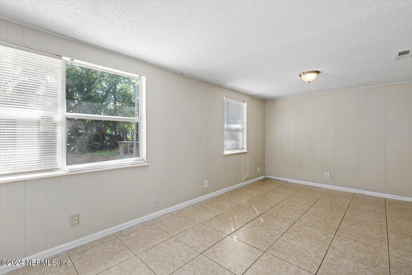 3724 South Lilly Road Jacksonville, FL 32207 - Photo 11 of 21 a view of an empty room with a window