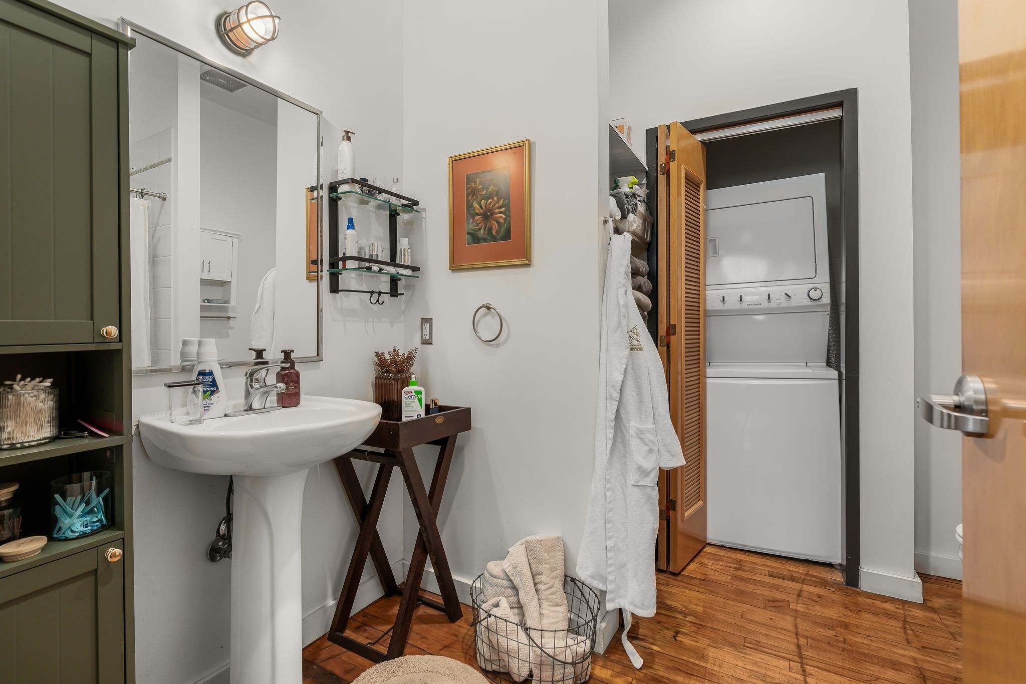 1400 Rosa L Parks Boulevard, Unit 211 Nashville, TN 37208 - Photo 12 of 36 a bathroom with a sink and a mirror