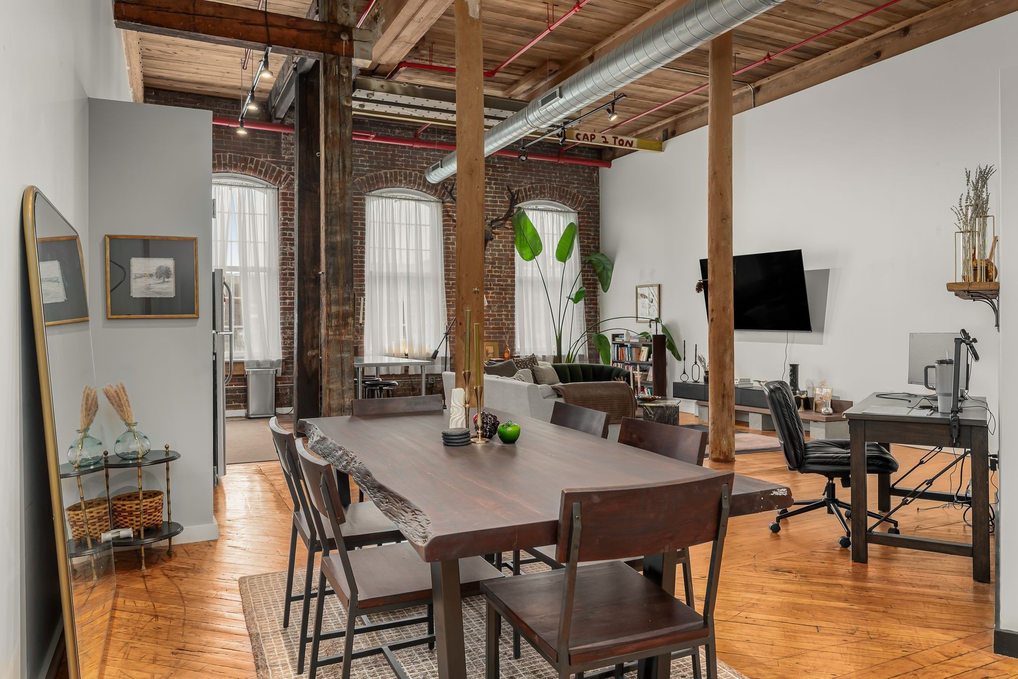 1400 Rosa L Parks Boulevard, Unit 211 Nashville, TN 37208 - Photo 2 of 36 a view of a dining room with furniture window and wooden floor